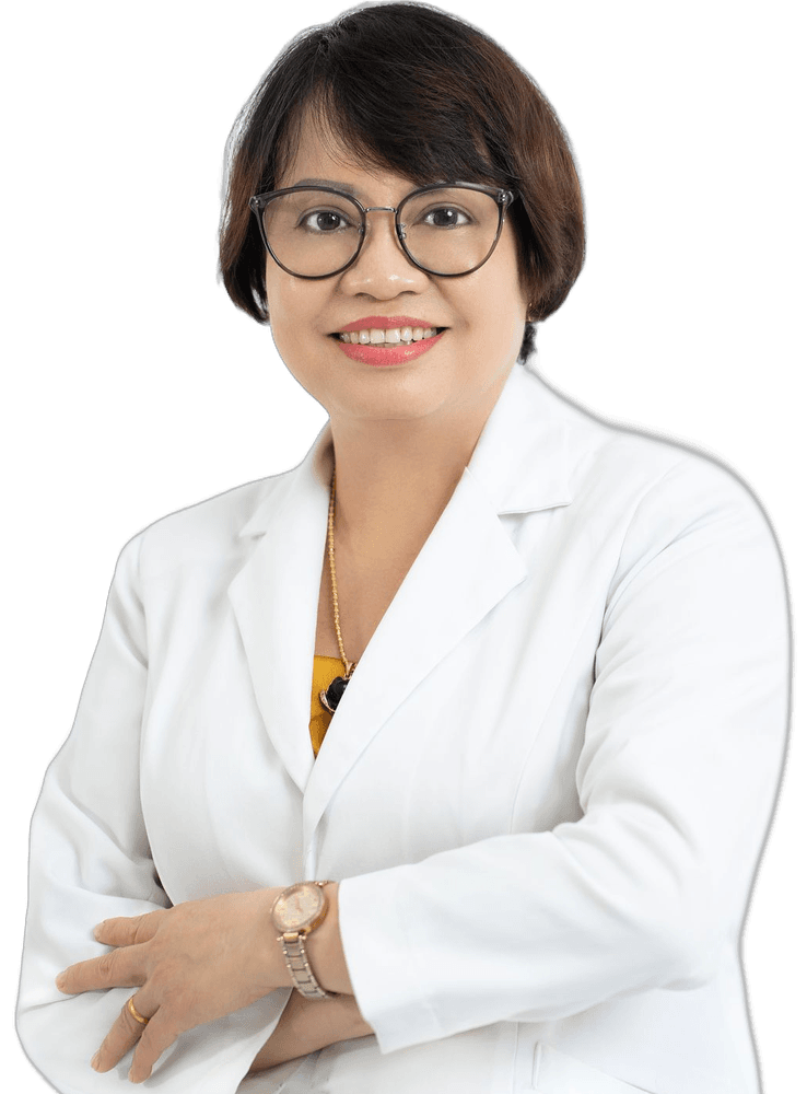 Smiling female doctor in a white coat with arms crossed