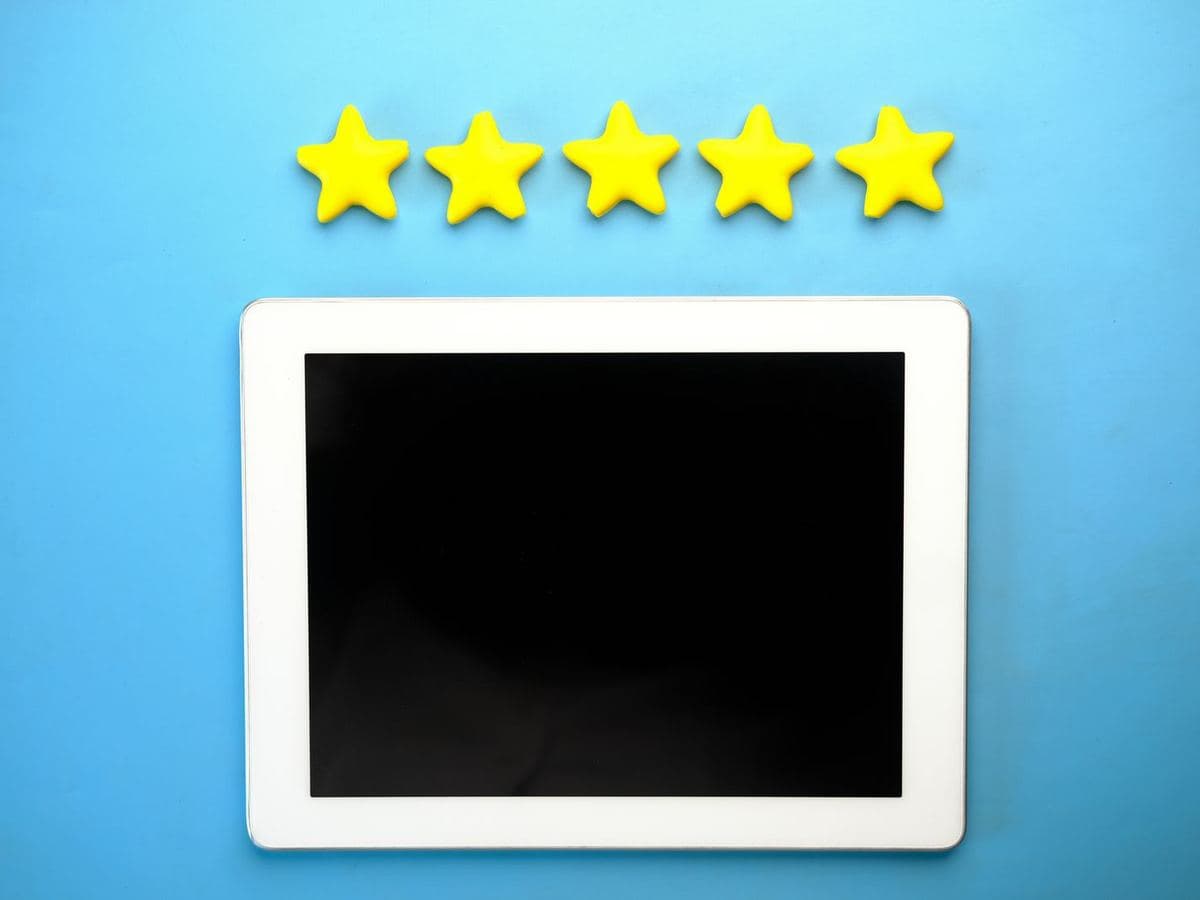 Five-star rating above a tablet